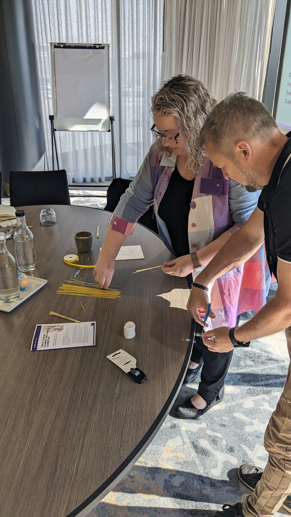 Participants immersed in a fun team activity during a workshop on innovation, leadership & wellbeing for a team of 50