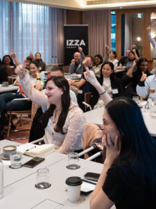 Participants immersed in a fun team activity during a workshop on innovation, leadership & wellbeing for a team of 50